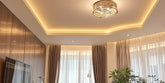 Modern ceiling lights illuminate a stylish room interior.